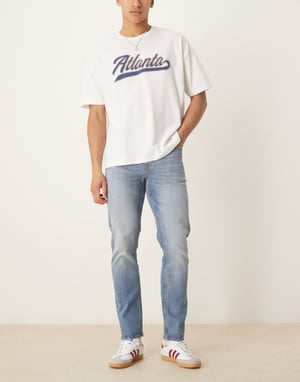 ASOS DESIGN slim fit jeans in vintage mid wash blue