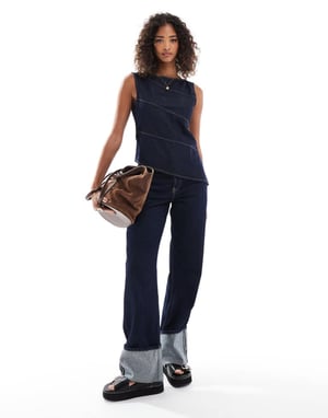 ASOS DESIGN asymmetrisk denimtopp med exponerade sömmar i indigo