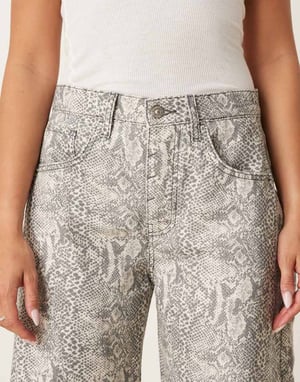 Free People good luck printed barrel jean in snake combo