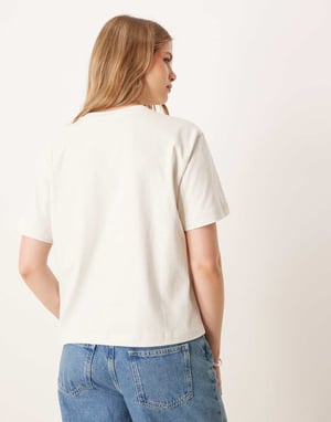 Calvin Klein varsity-logotrykt t-shirt i ecru och mintgrön
