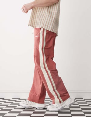 Prohibited stripe trackpants in red