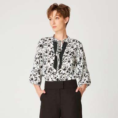 Tulip sleeves blouse with monochrome floral print and contrasting neckline
