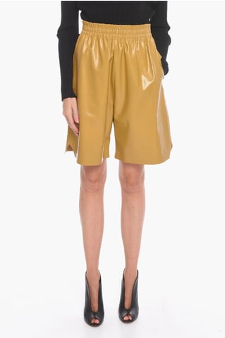GLANZENDE Gaucho-shorts van leer in geel
