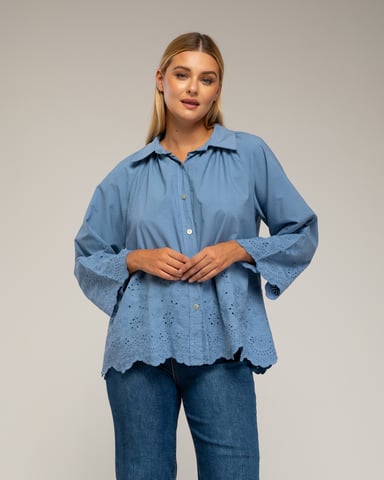 Oversized blouse with embroidery on the sleeves