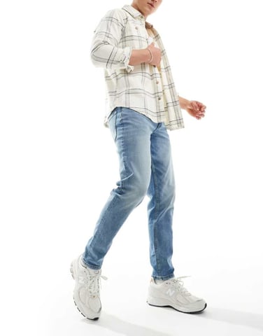 ASOS DESIGN stretch tapered jeans in mid wash blue