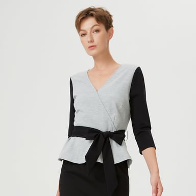 Color block peplum top with cross-heart effect and belt