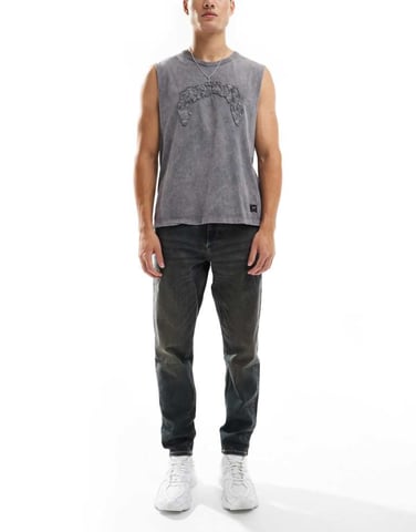 ASOS DESIGN tapered fit jeans in dark wash blue with tint