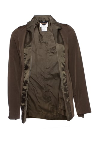 Comme Des Garçons green blazer with satin trim.