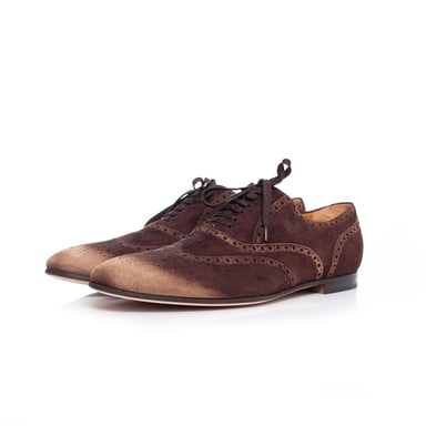 Gucci Suede wingtip derby with light noses.