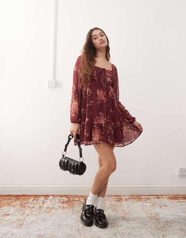 Reclaimed Vintage floaty long sleeve mini dress with tie front in burgundy floral print
