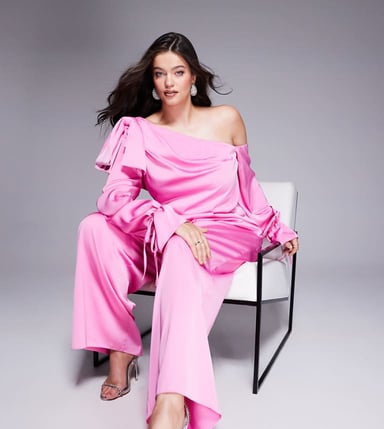 ASOS LUXE Curve satin off shoulder wide leg jumpsuit with bow in pink
