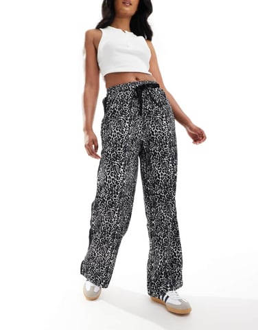 ASOS DESIGN pull on trousers with contrast panel in mono animal print