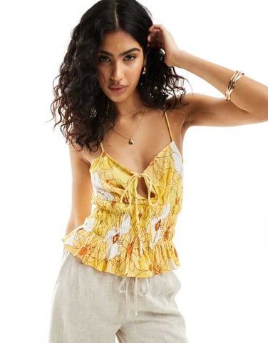 ASOS DESIGN shirred peplum cami suntop in yellow floral print