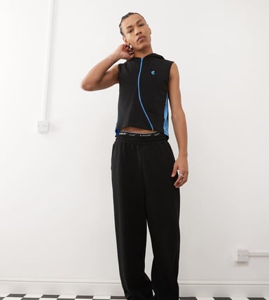 COLLUSION sleeveless jersey gilet with hood and curved zip in navy