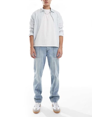 ASOS DESIGN straight leg jeans with panelling detail in light wash blue