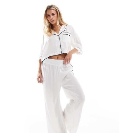 ASOS DESIGN Petite super soft slinky wide leg pyjama trouser in white with contrast binding