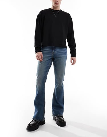 ASOS DESIGN stretch flare jeans in mid wash blue