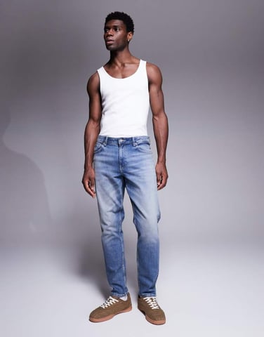 ASOS DESIGN tapered jeans in vintage light wash blue
