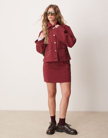 ASOS DESIGN seamed denim mini skirt co-ord in pomegranate