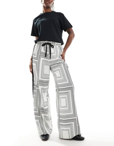 ASOS DESIGN pull on trousers with contrast panel in geo mono