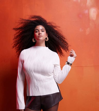 ASOS DESIGN Curve plisse long sleeve top with grown on neck in cream