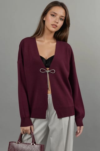 V-ringad stickad cardigan med rosettdetalj
