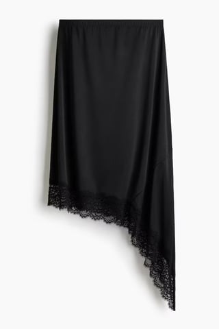 Asymmetrisk kjol med spetsdetaljer