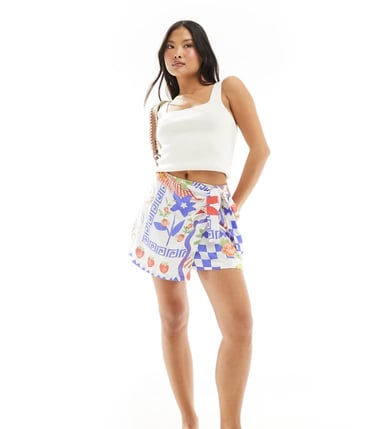 ASOS DESIGN Petite wrap detail skort in mosaic fruit print