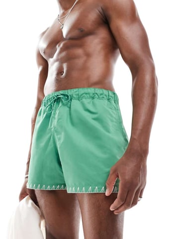 ASOS DESIGN swim short in short length in green with hem detail