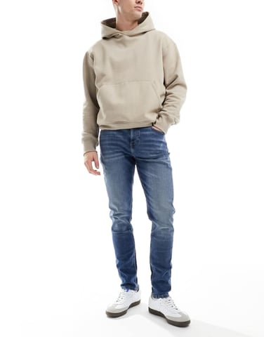 ASOS DESIGN skinny jeans in vintage mid wash blue