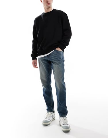 ASOS DESIGN tapered jeans with vintage tint in dark wash blue
