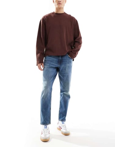 ASOS DESIGN stretch tapered fit jeans in dark wash blue