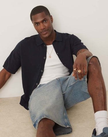 ASOS DESIGN relaxed lightweight knitted cotton button through polo in navy
