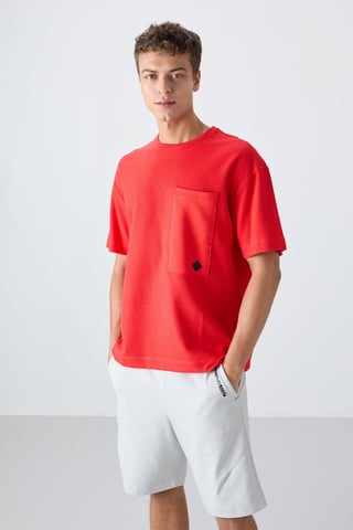 Överdimensionerad T-shirt i bomullsmix med rund hals och ficka