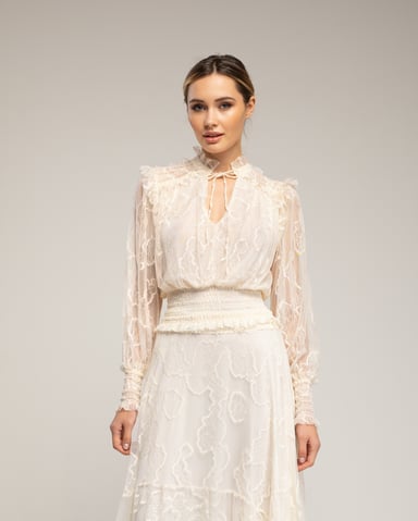 Lace top with elasticated cuffs and waistband, V-neck, and straps 