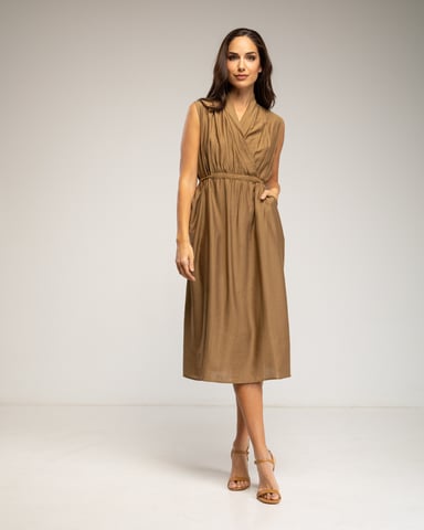 Sleeveless dress with crossover neckline, belt, and pockets