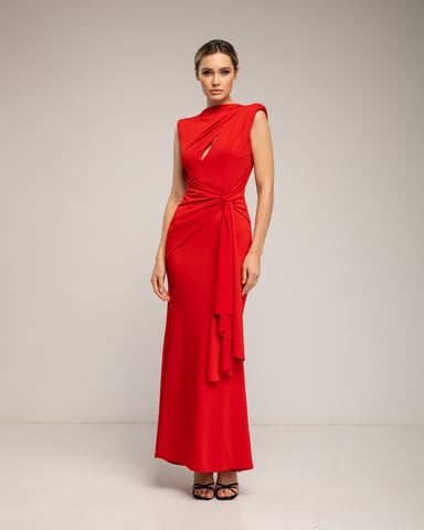 Long dress draped at the shoulder with slit and bow
