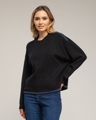 Oversized knit sweater with topstitching detail on the hem and shoulders