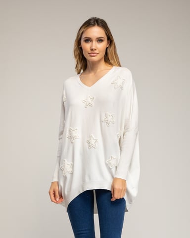 Long oversized knit sweater with fabric stars with sewn-on rhinestones