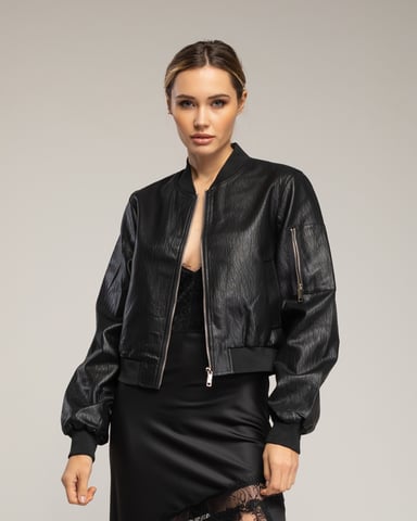 Faux leather bomber jacket with side pockets and zipper detail on the arm