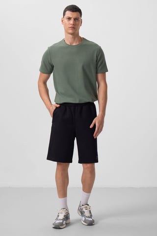Överdimensionerade bomullsblandade stickade shorts