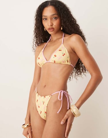 ASOS DESIGN Brielle bow and cherry print tie side bikini bottom in yellow