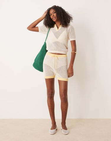 ASOS DESIGN co-ord knitted open stitch contrast trim shorts in cream and yellow