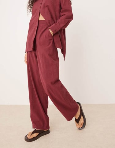 ASOS DESIGN seersucker relaxed pull on trousers co-ord in burgundy