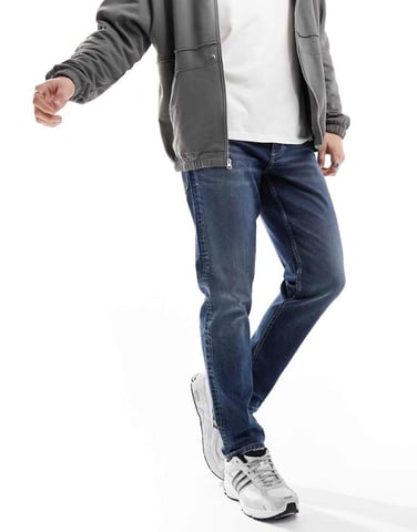 ASOS DESIGN stretch tapered jeans in mid wash blue