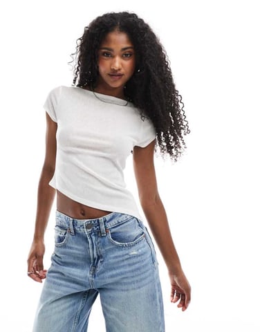 ASOS DESIGN semi sheer short sleeve top with asymmetric hem in ivory