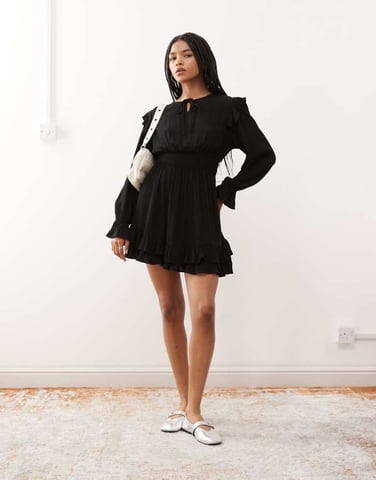 Reclaimed Vintage mini dress with shirred waist and ruffles in black