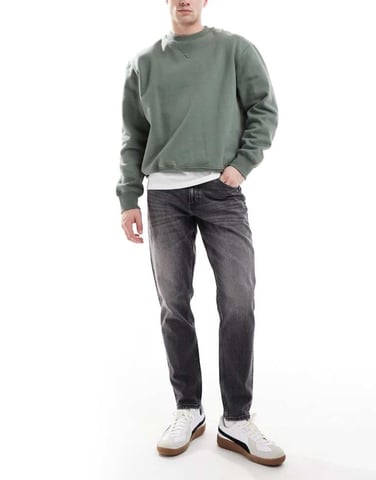 ASOS DESIGN stretch tapered jeans in vintage black wash