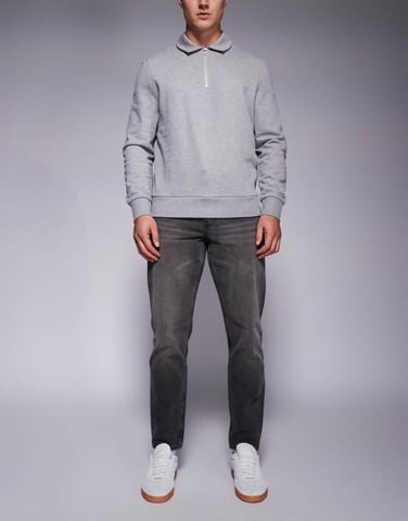 ASOS DESIGN tapered jeans with tint in black wash