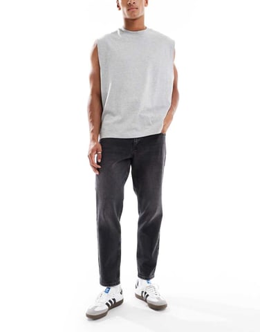 ASOS DESIGN tapered fit jeans in washed black
